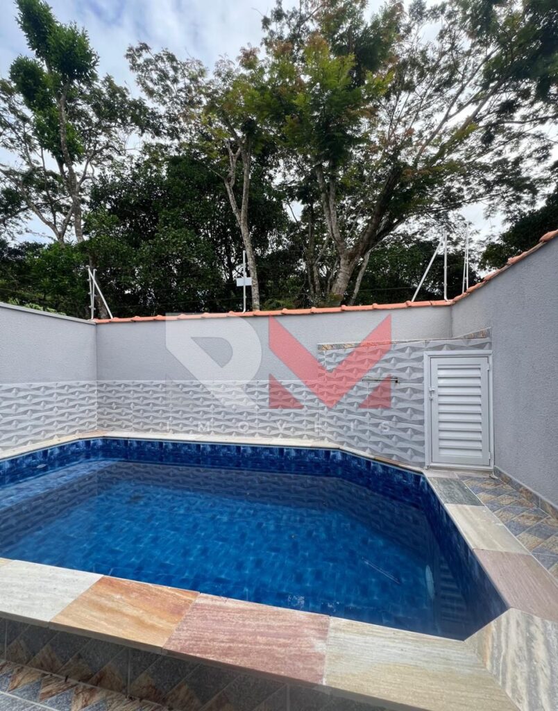 Casa com piscina localizada no bairro Jardim Comendador em Itanhaém/Sp